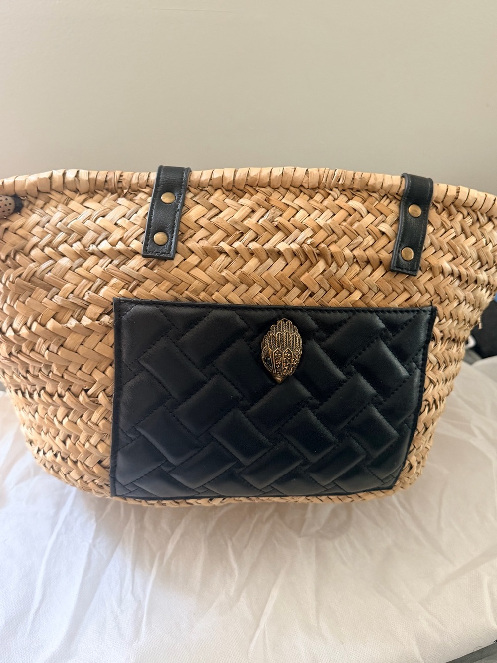 Kurt Geiger Woven Straw Tote with Black Quilted Pocket and Gold Hamsa Accent